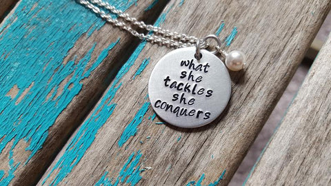 What She Tackles Necklace- Hand-Stamped Necklace "what she tackles she conquers" and with an accent bead in your choice of colors