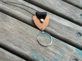 Leather and Mixed Metal Statement Necklace: Black, Copper, and Silver Pendant