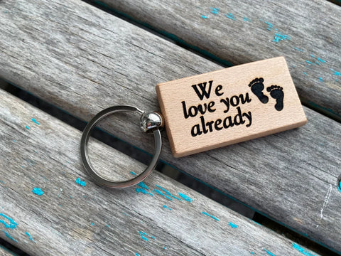 Quote Keychain- "We love you already” with footprints" -Wood Keychain