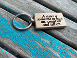Quote Keychain- "A sister is someone to lean on, count on and tell on." -Wood Keychain