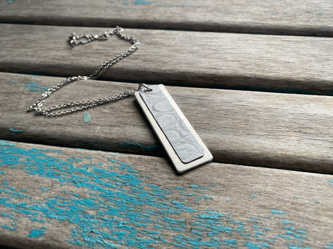 Textured White Leather and Silver Necklace: Modern Metal Pendant