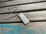 Textured White Leather and Silver Necklace: Modern Metal Pendant