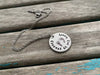 Inspirational Quote Necklace: "Forever in my heart" and has stamped footprints in the middle