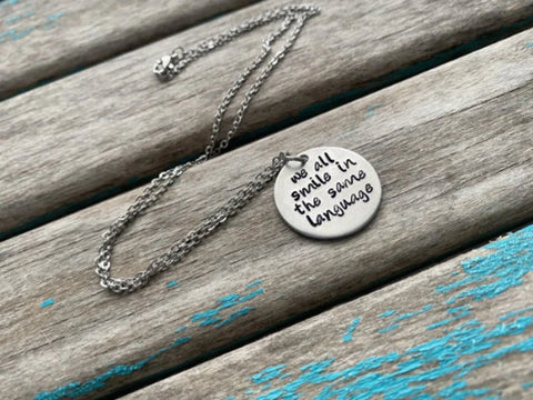 Inspirational Quote Necklace: "we all smile in the same language"