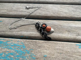 Orange, Silver, and Black Cluster Drop Necklace