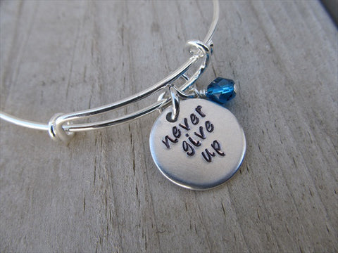 Never Give Up Bracelet- "never give up"  - Hand-Stamped Bracelet- Adjustable Bangle Bracelet with an accent bead of your choice