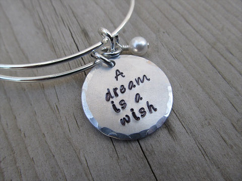 Dream Is A Wish Inspiration Bracelet- "A dream is a wish" - Hand-Stamped Bracelet- Adjustable Bangle Bracelet with an accent bead of your choice
