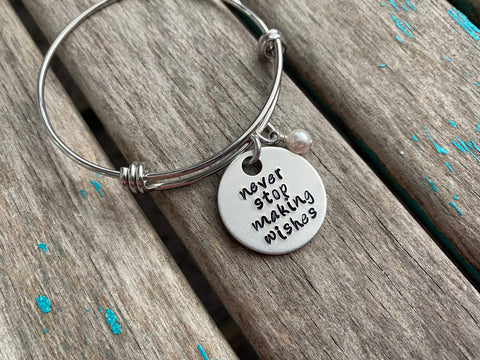 Wishes Bracelet- "never stop making wishes" - Hand-Stamped Bracelet  -Adjustable Bangle Bracelet with an accent bead of your choice