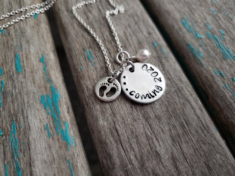 Expectant mother Necklace Gift- "...coming (year of your choice)"- with baby feet charm - Hand-Stamped Necklace with an accent bead in your choice of colors