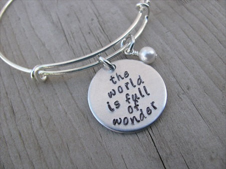 The World is Full of Wonder Bracelet- "the world is full of wonder" - Hand-Stamped Bracelet- Adjustable Bangle Bracelet with an accent bead of your choice