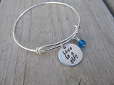 Love is a Gift Bracelet- "love is a gift"  - Hand-Stamped Bracelet- Adjustable Bangle Bracelet with an accent bead in your choice of colors