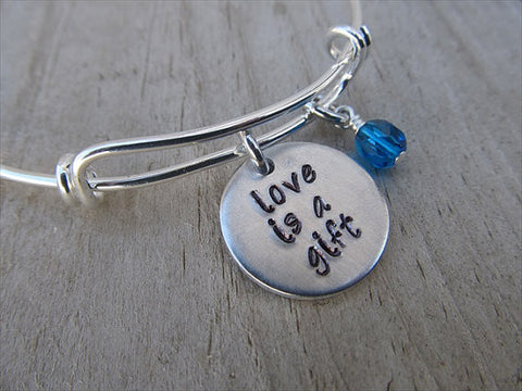 Love is a Gift Bracelet- "love is a gift"  - Hand-Stamped Bracelet- Adjustable Bangle Bracelet with an accent bead in your choice of colors