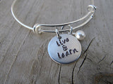 Live and Learn Bracelet - "live & learn"  - Hand-Stamped Bracelet- Adjustable Bangle Bracelet with an accent bead in your choice of colors