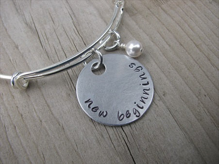New Beginnings Inspiration Bracelet- "new beginnings" - Hand-Stamped Bracelet- Adjustable Bangle Bracelet with an accent bead of your choice